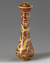 A CHINESE IRON-RED AND YELLOW-ENAMELLED 'DRAGON' BRUSH HANDLE, QING DYNASTY (1644-1911)