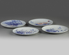 Four Chinese underglaze copper red blue and white 'floral' dishes