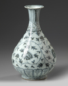 A Chinese blue and white 'scrolling peony' pear-shaped vase