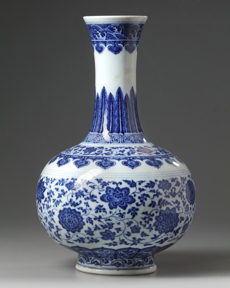 A Chinese blue and white 'scrolling lotus' bottle vase