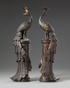 A PAIR OF CHINESE BRONZE PEACOCK CANDLE STICKS, 19TH CENTURY