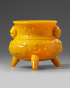 A CHINESE OPAQUE YELLOW GLASS TRIPOD CENSER 