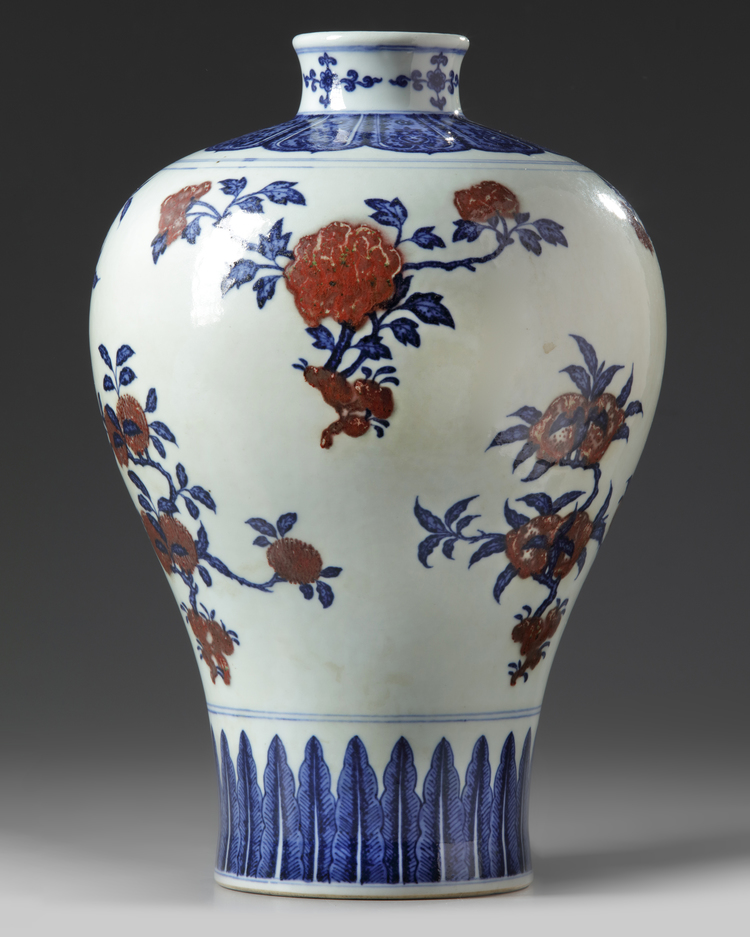 A Chinese underglaze copper red decorated blue and white meiping