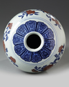 A Chinese underglaze copper red decorated blue and white meiping