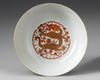 A Chinese yellow ground famille rose 'dragon and phoenix' bowl