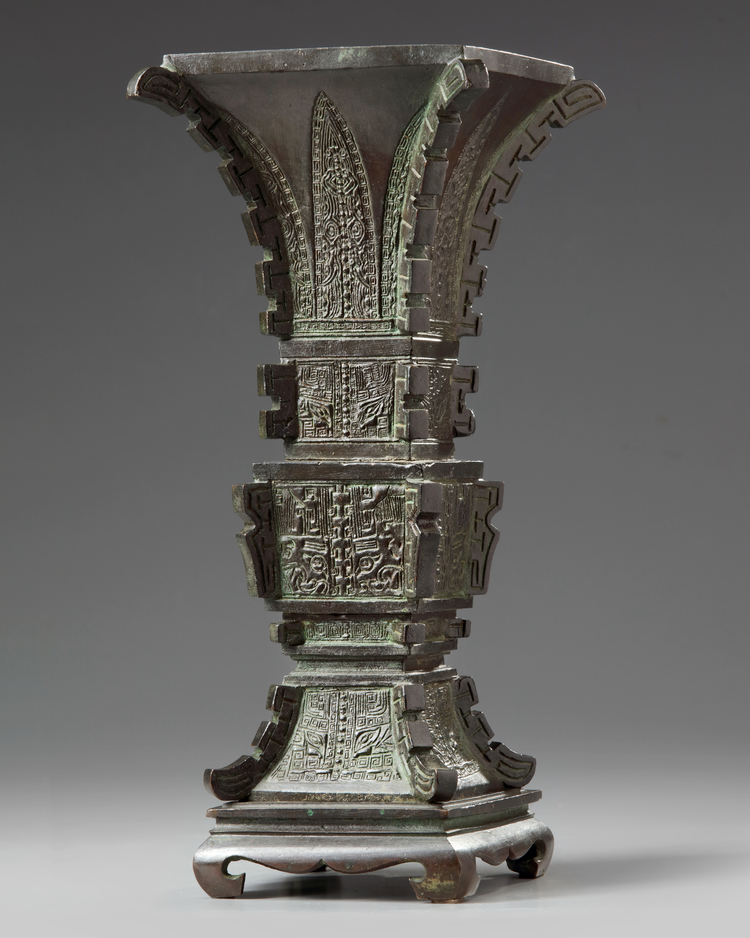 A Chinese archaistic bronze square section vase, fanggu