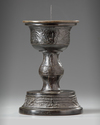 A Chinese bronze candle holder