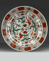 A CHINESE WANLI POLYCHROME-DECORATED 'CARPS' DISH, 16TH CENTURY