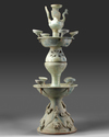A CHINESE GREEN-GLAZED POTTERY TWO-TIERED OIL LAMP