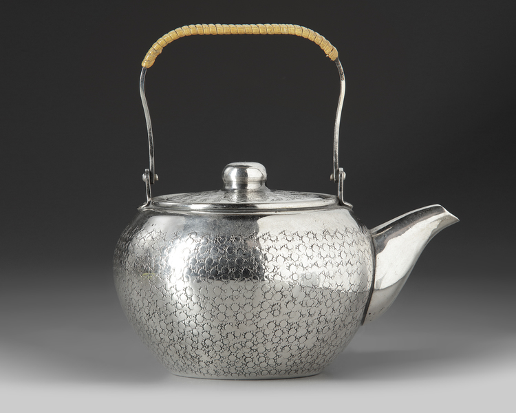 A Japanese silver teapot