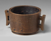 A CHINESE BRONZE TWIN-HANDLED CENSER