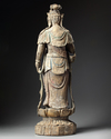 A large Chinese polychrome-decorated wood carving of Guanyin