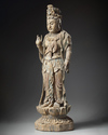 A large Chinese polychrome-decorated wood carving of Guanyin