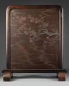 A JAPANESE WOODEN TUSITA SCREEN ON A STAND, MEIJI PERIOD (1868-1912)