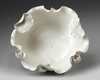 A Chinese white glazed 'lotus' bowl