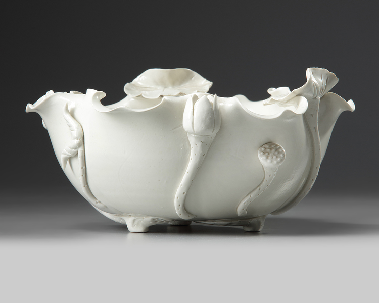 A Chinese white glazed 'lotus' bowl