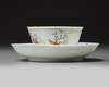 A Chinese famille rose ‘bird and flower’ cup and saucer