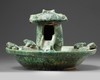 A Chinese green-glazed pottery frog pond