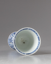 A Chinese blue and white stem beaker