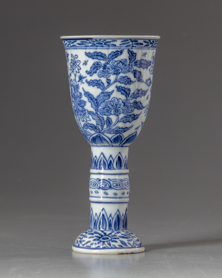 A Chinese blue and white stem beaker