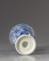 A Chinese blue and white stem beaker