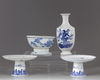 A group of four blue and white items
