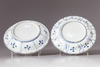 Two blue and white saucers