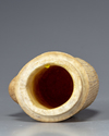 A Bactrian marble urn lid ststue