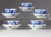 Five blue and white cups and saucers