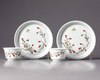A pair of Chinese famille verte cups and saucers