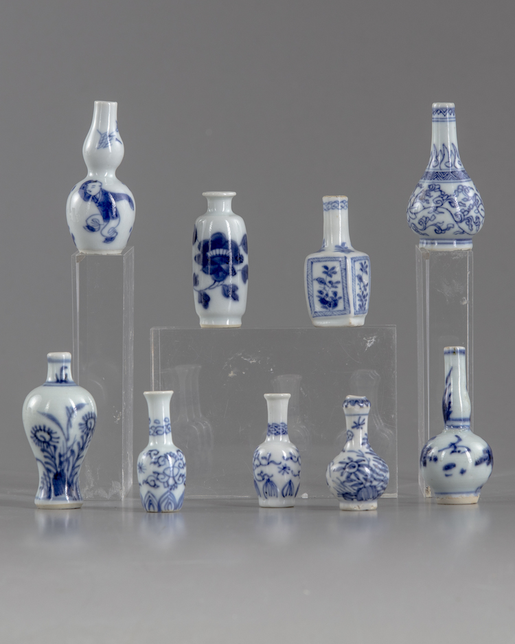 A group of nine miniature vases