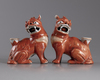 A pair of Chinese iron red glazed fu lions