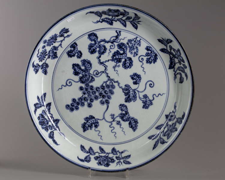 A large blue and white “grapes” charger