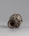 A ROMAN PURPLE GLASS HEAD FLASK, CIRCA 3RD CENTURY AD