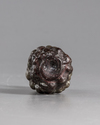 A ROMAN PURPLE GLASS HEAD FLASK, CIRCA 3RD CENTURY AD