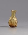 A ROMAN GLASS FLASK, CIRCA 3RD CENTURY AD