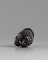 A ROMAN GLASS HEAD FLASK, CIRCA 3RD CENTURY AD
