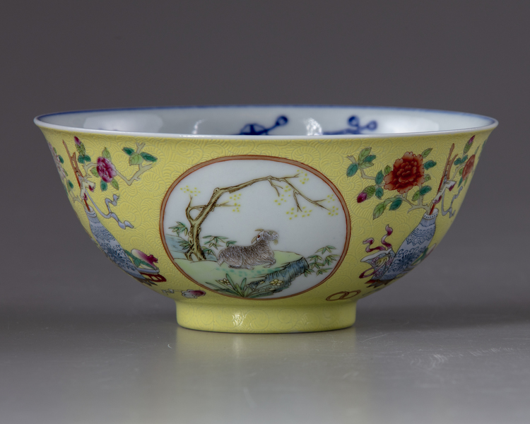 A Chinese famille rose yellow-ground sgraffiato 'Three Rams' medallion bowl