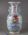 A CHINESE BLUE-GROUND FAMILLE ROSE 'DRAGONS' VASE