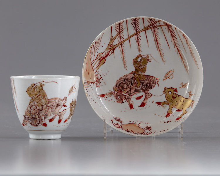 A gilt Chinese cup and saucer