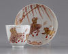 A gilt Chinese cup and saucer