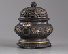 A Chinese parcel-gilt bronze 'sea creatures' censer, cover, and stand