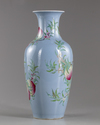 A Chinese blue-ground famille rose 'peaches' vase
