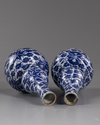 TWO CHINESE BLUE AND WHITE DOUBLE-GOURD VASES