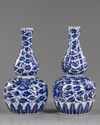 TWO CHINESE BLUE AND WHITE DOUBLE-GOURD VASES