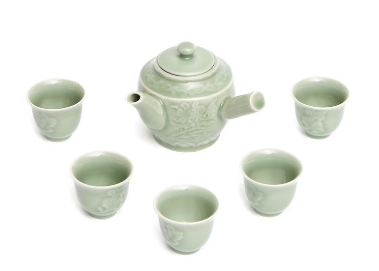 A Japanese Nabeshima-ware celadon sencha-tea set consisting of a tea pot (kyūsu)  with a perpendicular handle (yokote)