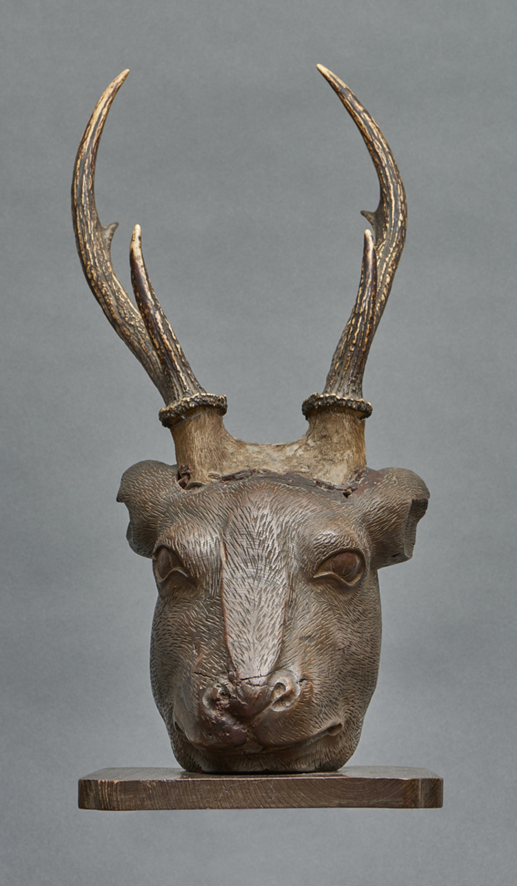 A Japanese wooden head of a stag