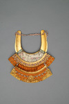 A large gilded Japanese ōyoroi with orange cords (hi’ito odoshi yoroi). A large hoshikabuto-helmet with gilded parts, large fukikaeshi