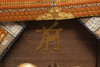 A large gilded Japanese ōyoroi with orange cords (hi’ito odoshi yoroi). A large hoshikabuto-helmet with gilded parts, large fukikaeshi