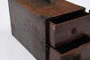 A rare Japanese rectangular portable wooden box with four drawers of various size behind a door
